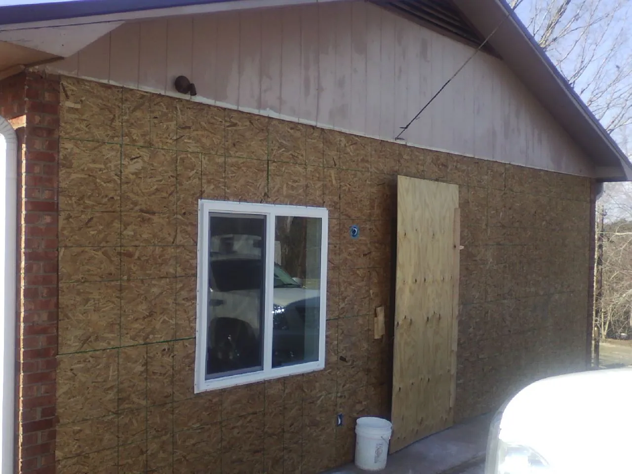 OSB sheathing on a garage addition wall before siding in Ardmore